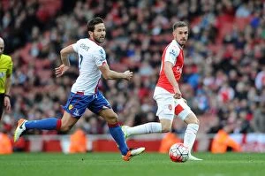 Images Dated 17th April 2016: Arsenal's Ramsey Outmaneuvers Cabaye: Thrilling Moment from Arsenal vs Crystal Palace (2015-16)
