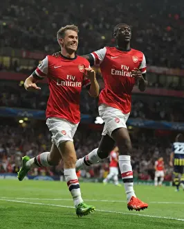 Arsenal V Fenerbahce 2013-14 Prints: Arsenal's Ramsey and Sanogo: Celebrating Goals in UEFA Champions League Play-offs Against Fenerbahce (2013-14)