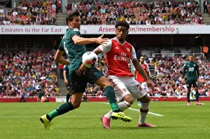 Arsenal's Reiss Nelson Clashes with Burnley's Jack Cork in Premier League Showdown
