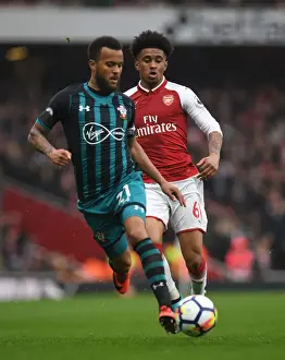 Arsenal V Southampton 2017-18 Prints: Arsenal's Reiss Nelson Closes In on Southampton's Ryan Bertrand in Intense Premier League Clash