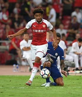 Images Dated 23rd July 2017: Arsenal's Reiss Nelson Faces Off Against Chelsea's Kennedy in Beijing Pre-Season Clash
