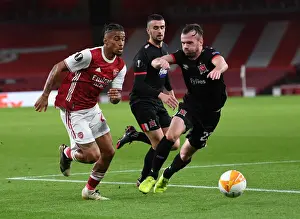 Arsenal V Dundalk 2020-21 Prints: Arsenal's Reiss Nelson Faces Off Against Dundalk's Cameron Dummigan in Empty Emirates Stadium - UEFA Europa