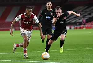 Arsenal V Dundalk 2020-21 Prints: Arsenal's Reiss Nelson Faces Off Against Dundalk's Cameron Dummigan in Empty Emirates Stadium - UEFA Europa