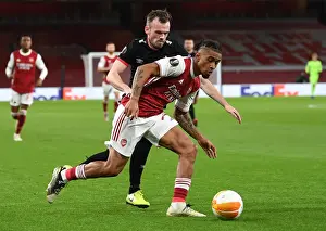 Arsenal V Dundalk 2020-21 Prints: Arsenal's Reiss Nelson Faces Off Against Dundalk's Cameron Dummigan in Empty Emirates Stadium - UEFA Europa