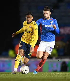 Portsmouth v Arsenal FA Cup 5th Rd 2020 Collection: Arsenal's Reiss Nelson Faces Off Against Portsmouth's Ben Close in FA Cup Fifth Round Showdown