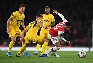 Arsenal v Standard Liege 2019-20 Collection: Arsenal's Reiss Nelson Faces Off Against Standard Liege's Mergim Vojvoda in UEFA Europa League Clash