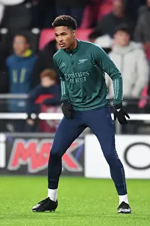 PSV Eindoven V Arsenal 2023-24 Prints: Arsenal's Reuell Walters Warming Up Ahead of PSV Eindhoven Clash in 2023-24 UEFA Champions League