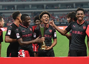 Arsenal's Rising Stars: Reiss Nelson, Joe Willock, and Eddie Nketiah in Action against Bayern Munich (2017-18)