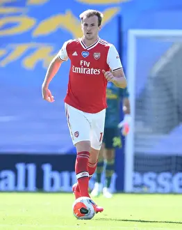 Brighton And Hove Albion V Arsenal 2019-20 Prints: Arsenal's Rob Holding in Empty American Express Community Stadium: Brighton vs