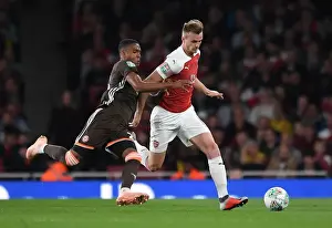 Arsenal V Brentford - Carabao Cup 2018-19 Prints: Arsenal's Rob Holding Clashes with Brentford's Ezri Konsa in Carabao Cup Showdown