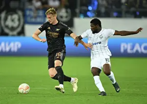 FC Zurich V Arsenal 2022-23 Prints: Arsenal's Rob Holding Intensely Focuses on FC Zurich's Tosin Aiyegun during Europa League Clash