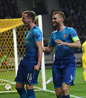 FC BATE Borisov V Arsenal 2017-18 Prints: Arsenal's Rob Holding and Per Mertesacker Celebrate Goals in UEFA Europa League Match