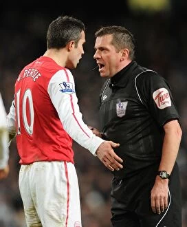 Images Dated 18th December 2011: Arsenal's Robin van Persie Clashes with Referee Phil Dowd during Manchester City vs Arsenal