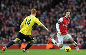Images Dated 22nd February 2014: Arsenal's Rosicky Clashes with Sunderland's Colback in Premier League Showdown