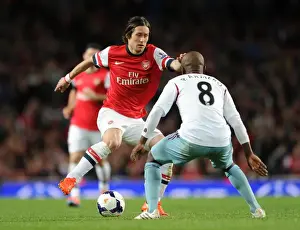 Arsenal V West Ham United 2013/14 Prints: Arsenal's Rosicky Clashes with West Ham's Armero in Premier League Showdown