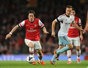 Arsenal's Rosicky Clashes with West Ham's Noble in Premier League Showdown