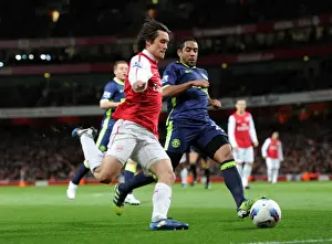 Arsenal V Wigan Athletic 2011-12 Prints: Arsenal's Rosicky Faces Off Against Wigan's Beausejour in Intense Premier League Clash