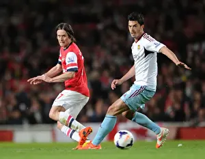 Arsenal's Rosicky Fends Off West Ham's Tomkins Pressure in Premier League Clash