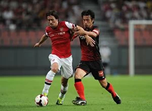 Nagoya Grampus v Arsenal 2013-14 Collection: Arsenal's Rosicky Fouled by Nakamura in Nagoya Grampus Clash (2013)