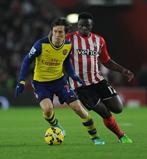 Southampton v Arsenal 2014-15 Collection: Arsenal's Rosicky Outmaneuvers Southampton's Wanyama in Premier League Clash