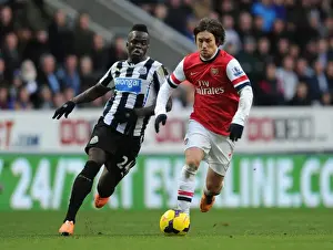 Newcastle United V Arsenal 2013-14 Prints: Arsenal's Rosicky Outsmarts Tiote: Agile Moves in the 2013-14 Arsenal-Newcastle Midfield Battle