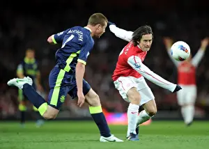 Arsenal V Wigan Athletic 2011-12 Prints: Arsenal's Rosicky Outwits Wigan's McCarthy: A Battle of Midfield Maestros in the Premier League