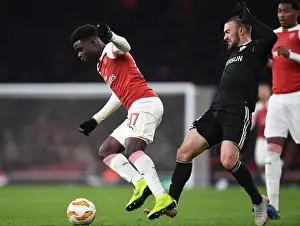 Arsenal's Saka Drives Past Qarabag's Gara Gareyev in Europa League Clash