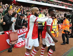 Arsenal's Saka and Lacazette: Celebrating a Goal Against Manchester City (2021-22)