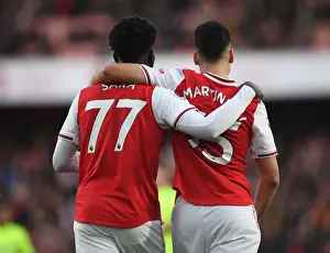 Arsenal's Saka and Martinelli in Action: A Premier League Battle at Emirates Stadium