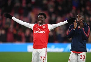 Arsenal v Newcastle United 2019-20 Collection: Arsenal's Saka and Nketiah Celebrate Victory Over Newcastle United