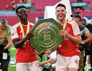 Arsenal's Saka and Rice Celebrate FA Community Shield Victory over Manchester City