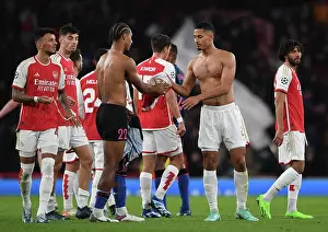 Arsenal's Saliba and Bade Exchange Shirts After Arsenal FC vs Sevilla FC - UEFA Champions League Group Stage 2023/24