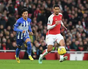 Arsenal V Brighton And Hove Albion 2023-24 Prints: Arsenal's Saliba Chased by Mitoma in Intense Arsenal v Brighton Clash (2023-24)