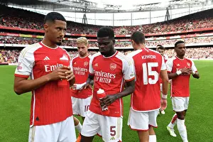 Arsenal's Saliba and Partey Share a Moment Before Arsenal FC vs AS Monaco (2023-24 Emirates Cup)