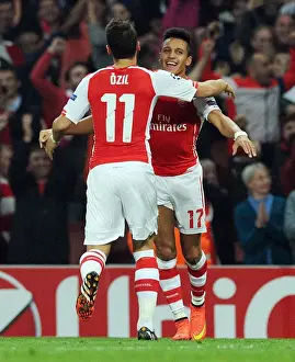 Arsenal V Galatasaray 2014/15 Champions League Prints: Arsenal's Sanchez and Ozil Celebrate Goals Against Galatasaray in 2014 Champions League Match