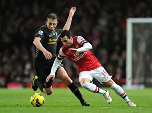Arsenal V Liverpool 2012-13 Prints: Arsenal's Santi Cazorla Clashes with Liverpool's Lucas Leiva in Premier League Showdown