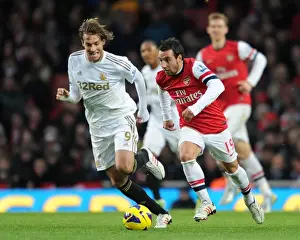 Arsenal V Swansea 2012-13 Prints: Arsenal's Santi Cazorla Clashes with Swansea's Miguel Michu in Premier League Showdown (2012-13)