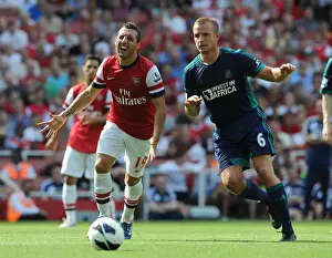 Arsenal V Sunderland 2012-13 Prints: Arsenal's Santi Cazorla Faces Off Against Sunderland's Lee Catermole in Premier League Clash