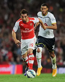 Arsenal V Tottenham Hotspur 2014-15 Prints: Arsenal's Santi Cazorla Faces Off Against Tottenham in the 2014-15 Premier League