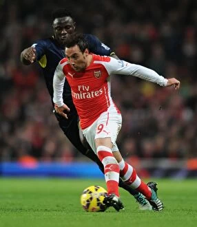Images Dated 3rd December 2014: Arsenal's Santi Cazorla Outmaneuvers Southampton's Victor Wanyama in Premier League Clash