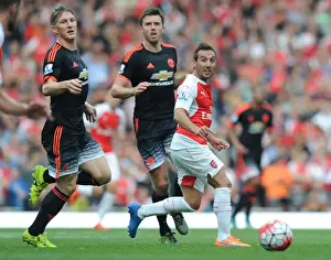 Arsenal V Manchester United 2015/16 Prints: Arsenal's Santi Cazorla Outsmarts Manchester United's Schweinsteiger and Carrick