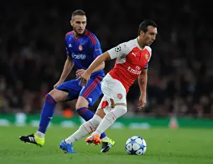 Arsenal V Olympiacos 2015/16 Prints: Arsenal's Santi Cazorla Outsmarts Olympiacos Pajtim Kasami in Thrilling 2015/16 Champions League Showdown
