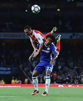 Arsenal V Chelsea 2016-17 Prints: Arsenal's Santi Cazorla Soars Above Chelsea's Willian