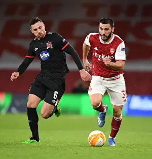 Arsenal V Dundalk 2020-21 Prints: Arsenal's Sead Kolasinac Overpowers Dundalk's Jordan Flores in Empty Emirates Stadium - UEFA Europa League