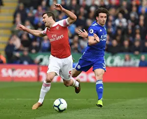 Leicester City V Arsenal 2018-19 Prints: Arsenal's Sead Kolasinac Tripped by Leicester's Ben Chilwell in Intense Premier League Clash