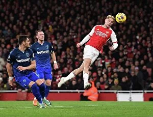 Arsenal v West Ham United 2023-24 Collection: Arsenal's Smith Rowe Goes for Glory: A Headed Shot vs. West Ham United (2023-24)