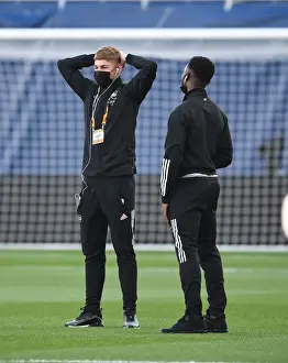 Arsenal's Smith Rowe and Nketiah Prepare for Villarreal Semi-Final Amid Empty Stands
