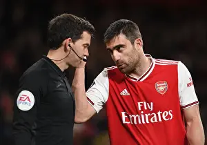 Arsenal V Leeds United FA Cup 2019-20 Prints: Arsenal's Sokratis in Deep Discussion with FA Cup Linesman: A Pivotal Moment during Arsenal vs Leeds United