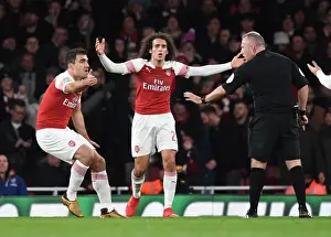Arsenal's Sokratis and Guendouzi Protest Ref's Decision in Intense Arsenal vs. Tottenham Carabao Cup Clash
