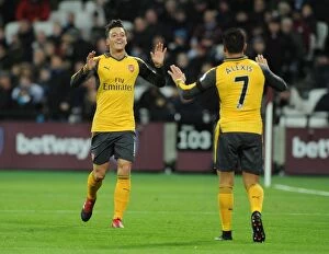 Images Dated 3rd December 2016: Arsenal's Star Duo: Ozil and Sanchez Celebrate a Goal against West Ham United